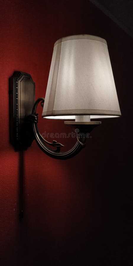 Lighting on red wall stock photo. Image of lamp, furniture 200171610