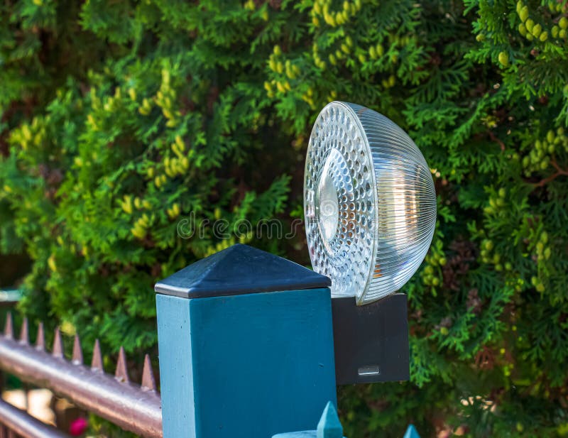 Lighting Spotlight on the Fence Post. Outdoor Lighting System Stock Photo Image of power
