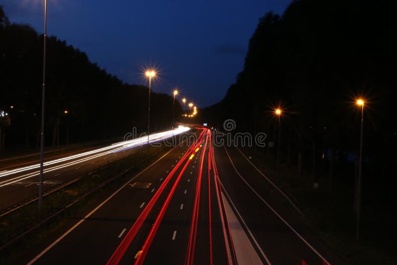Lightlines at highway A20 at Nieuwerkerk aan den IJssel with high shutter opening time and high diagragma stock photography Lightlines at highway A20 at Nieuwerkerk aan den IJssel with high shutter opening time and high diagragma stock photography