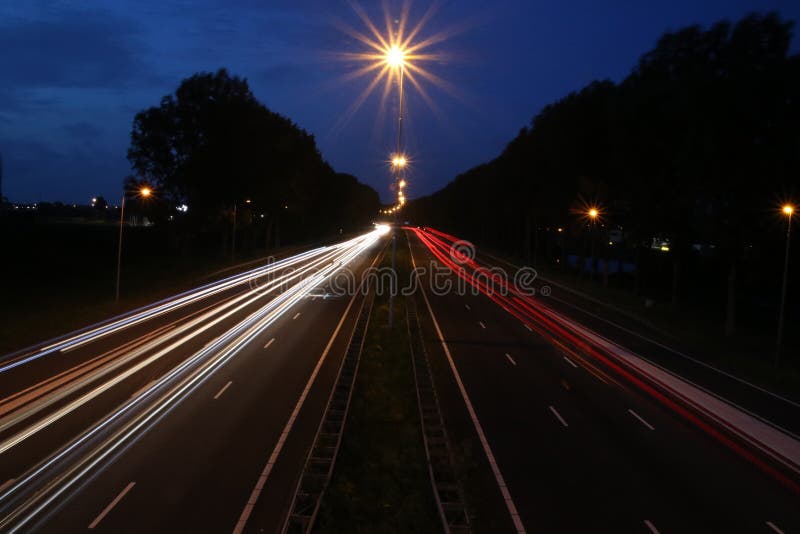 Lightlines at highway A20 at Nieuwerkerk aan den IJssel with high shutter opening time and high diagragma stock photo Lightlines at highway A20 at Nieuwerkerk aan den IJssel with high shutter opening time and high diagragma stock photo