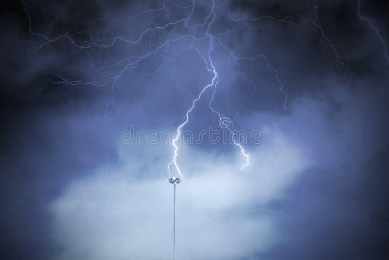Lightning rod against a cloudy dark sky. Natural electric energy stock photo