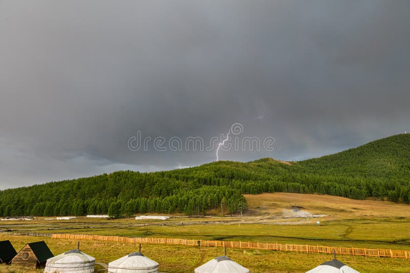 A lightning strikes the ground of the Mongolian steppe at Tsenkher Hot Springs