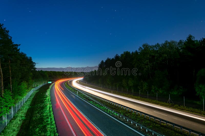 Lights of moving cars at night. long exposure