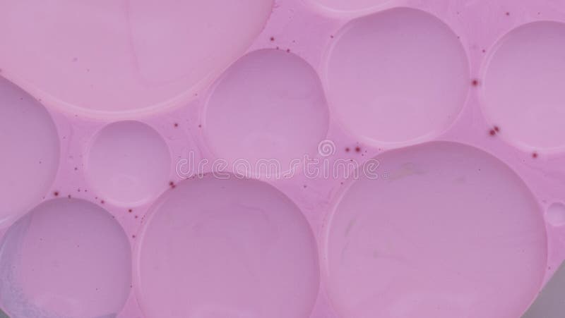 Waterpaint and oil mixing experiments. Magic, colourful and beautiful effect. Pink Bubbles in the abstract environment. Waterpaint and oil mixing experiments. Magic, colourful and beautiful effect. Pink Bubbles in the abstract environment