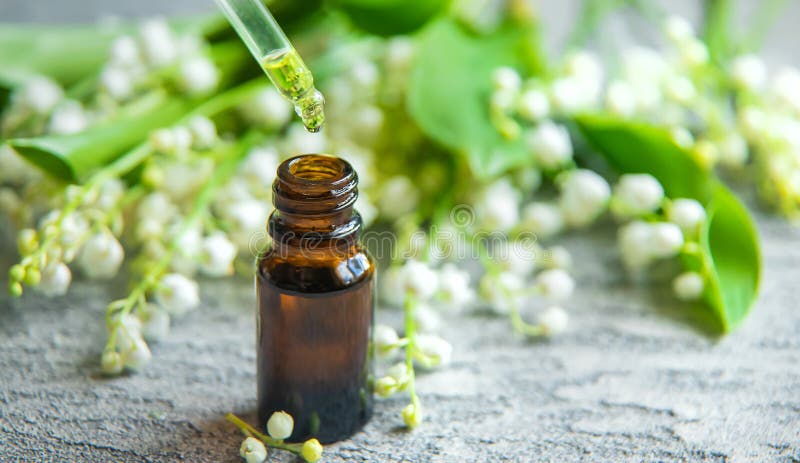 Lily of the valley essential oil in a small bottle. Selective