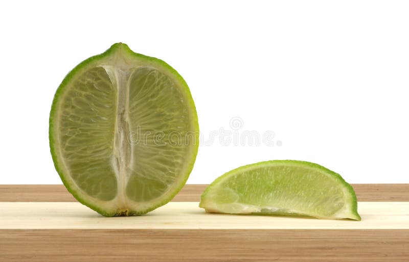 Lime on cutting board stock image. Image of tart, lime 8533549