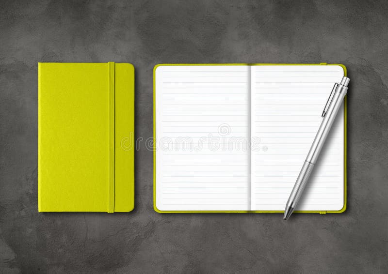 Lime green closed and open lined notebooks with a pen on dark concrete background stock images