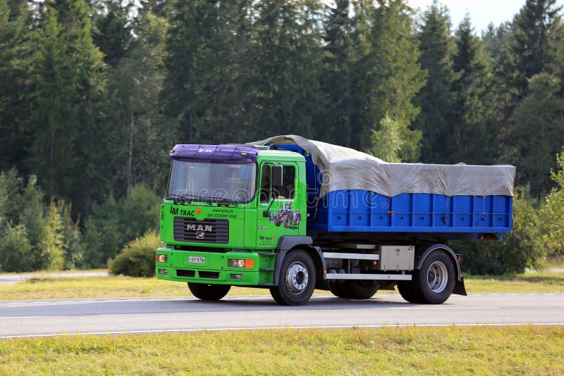 Lime Green MAN 18. 284 Truck on Motorway stock photo Lime Green MAN 18. 284 Truck on Motorway stock photo