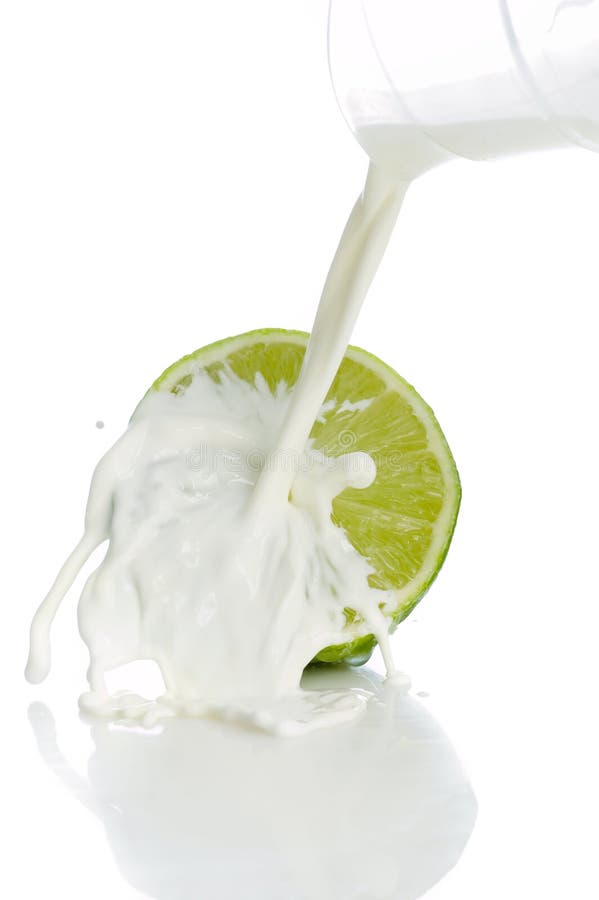 Lime with splashing milk stock photo. Image of ripe, white 39856900