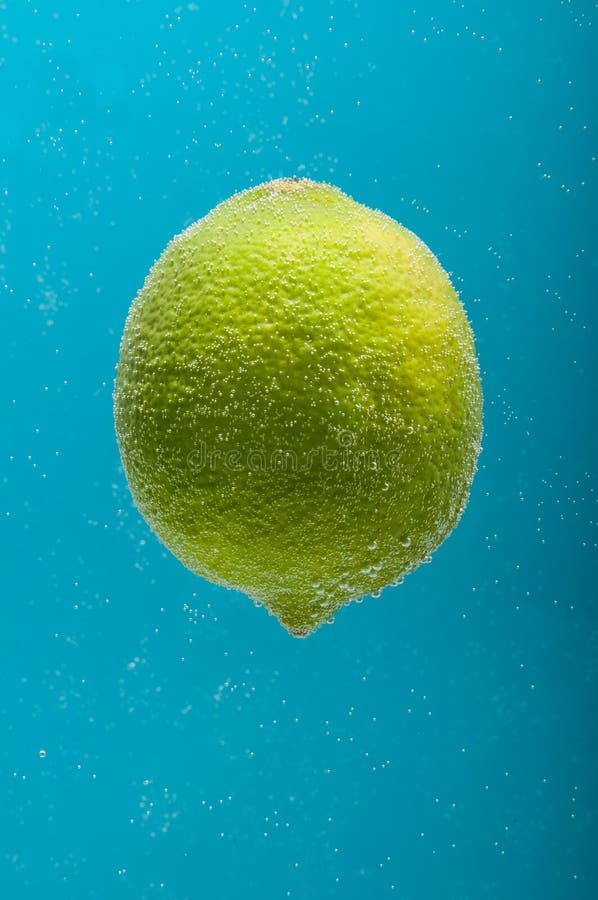 Lime in water stock photo. Image of lime, submerged, liquid 46236750