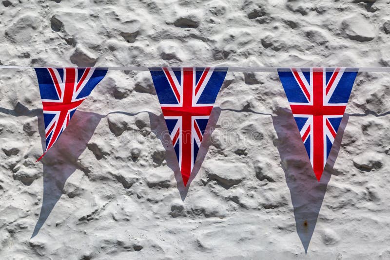 Union jack bunting against a white wall. Union jack bunting against a white wall