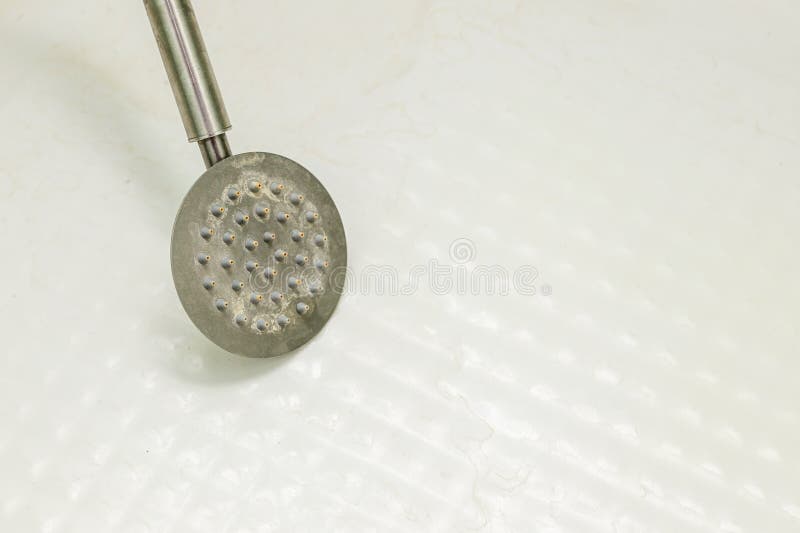 Limescale on the shower head and shower cabin. How to remove limescale in the bathroom. Dirty shower head. stock images