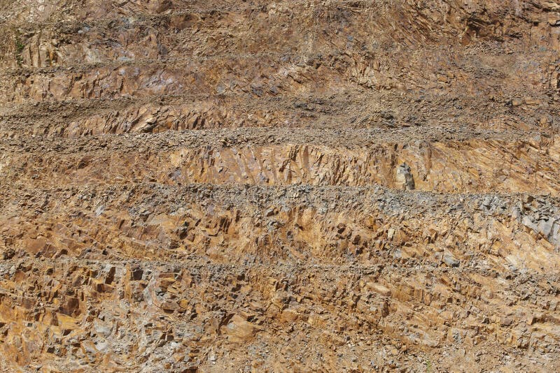 Limestone Quarry Vertical Wall. Rocky Substrate by Levels Stock Photo