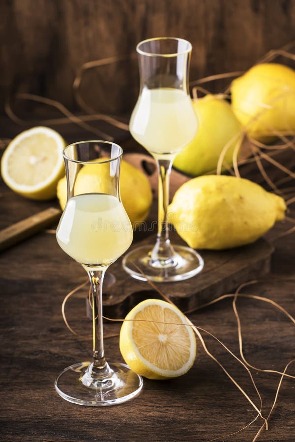 Limoncello, sour sweet Italian lemon liqueur, traditional strong alcoholic drink. Copy space, selective focus