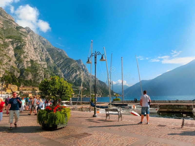 Limone sul Garda, Italy - September 21, 2014: The boardwalk with houses and boats