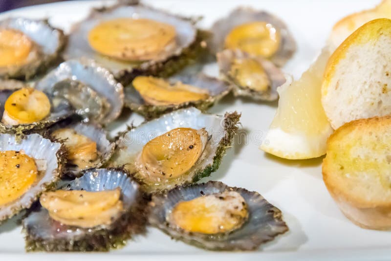 Delicious local limpets served in a restaurant on the island of Flores in the Azores, Portugal