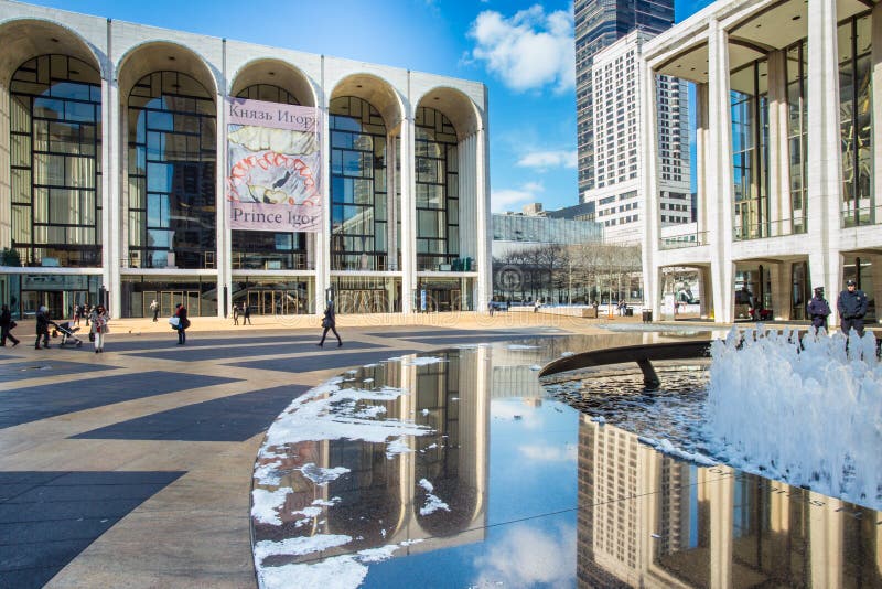 NEW YORK CITY - FEB. 10, 2014: The Lincoln Center Plaza in New York City. Lincoln Center is home to the Metropolitan Opera, NYC Ballet, NY Philharmonic, Avery Fisher Hall and the Juilliard School. NEW YORK CITY - FEB. 10, 2014: The Lincoln Center Plaza in New York City. Lincoln Center is home to the Metropolitan Opera, NYC Ballet, NY Philharmonic, Avery Fisher Hall and the Juilliard School.