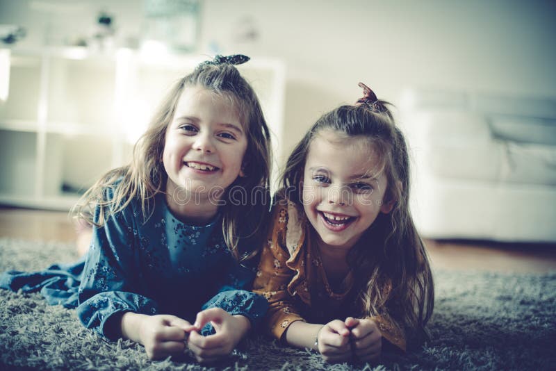 Cute and carefree as can be. Two little girls at home. Copy space. Cute and carefree as can be. Two little girls at home. Copy space
