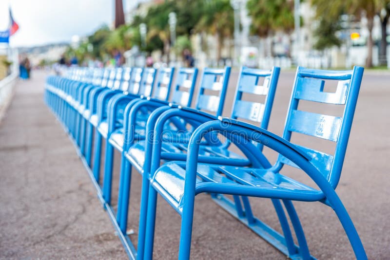 Line of blue chairs on street stock images Line of blue chairs on street stock images