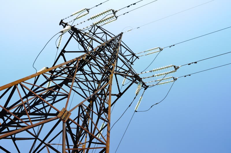 High tension power lines, blue sky behind. High tension power lines, blue sky behind