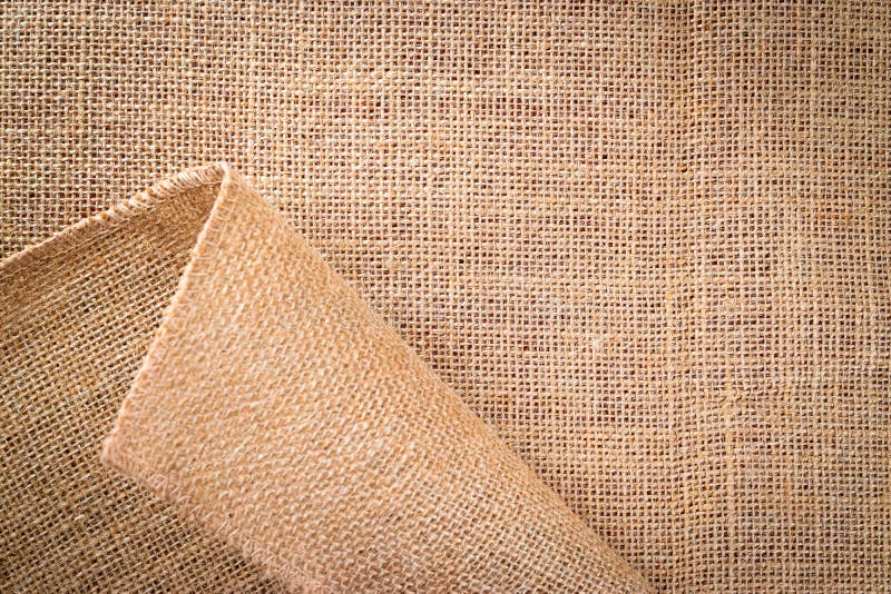 Linen background. Natural organic beige canvas. Brown woven Backdrop. Linen weave Material cotton background
