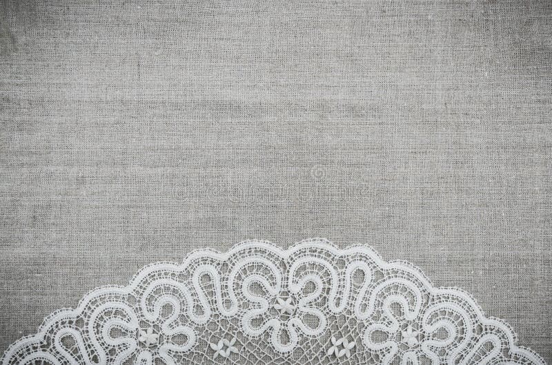 Linen fabric and white lace. Decorative background for cards