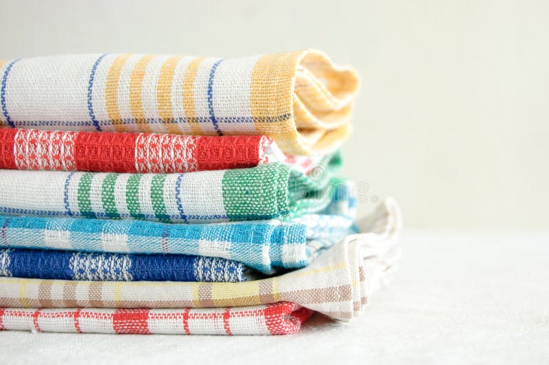 Stack Of Neatly Folded Colorful Kitchen Towels, On White Background. Stock  Photo, Picture and Royalty Free Image. Image 91284583.