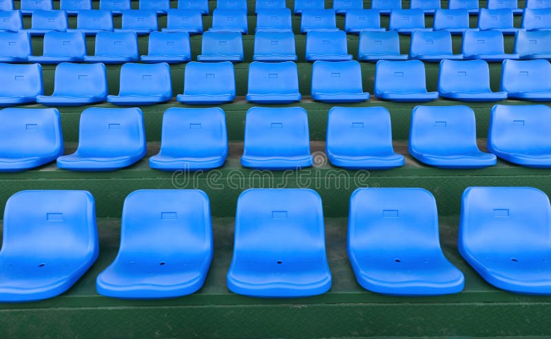 Lines of blue stadium seats horizontal