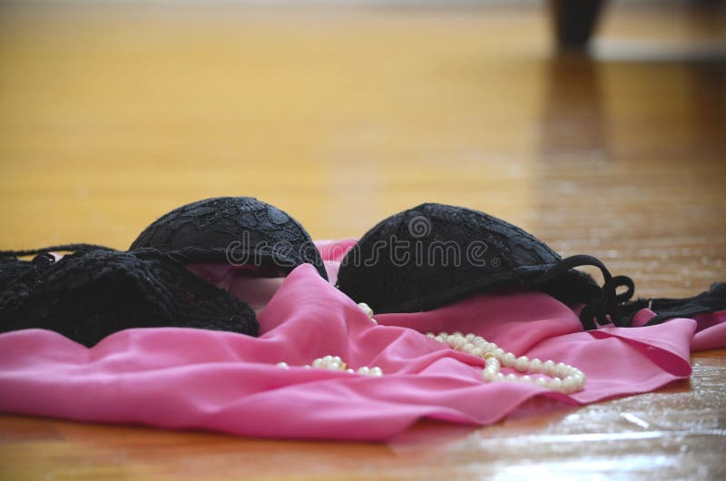 Lingerie and Clothes Thrown on the Floor Stock Photo - Image of