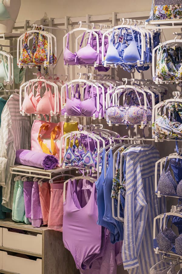 Many different beautiful women's underwear. Heap of Many multicolored bra  and Different sizes of underwear at lingerie shop department store. Big sale  special offer. Super Sale, End of season special. Stock Photo