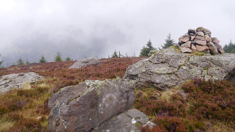 By cairn looking across low cloud valley to hills beyond royalty free stock images By cairn looking across low cloud valley to hills beyond royalty free stock images
