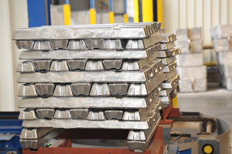 Aluminum ingots stacked on a. Aluminum ingots stacked on a