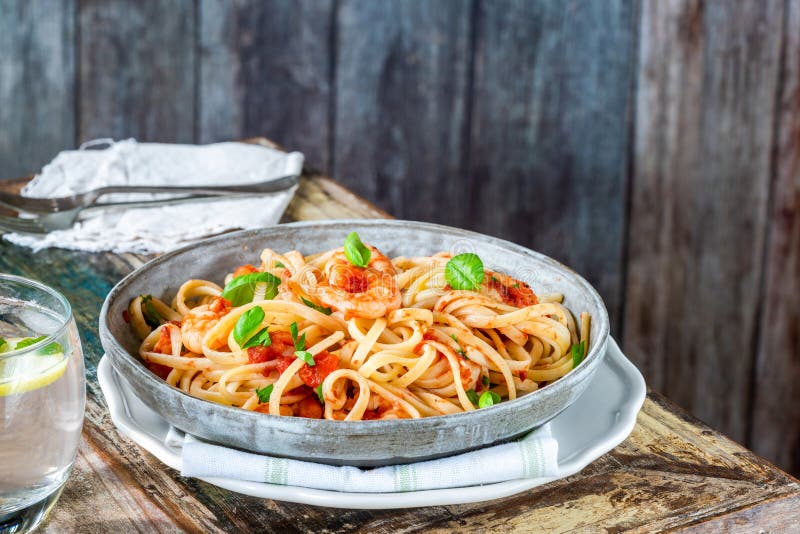Linguine pasta with prawns stock images