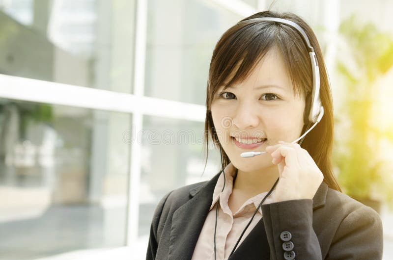 Linha aberta fêmea asiática do cliente imagem de stock Linha aberta fêmea asiática do cliente imagem de stock