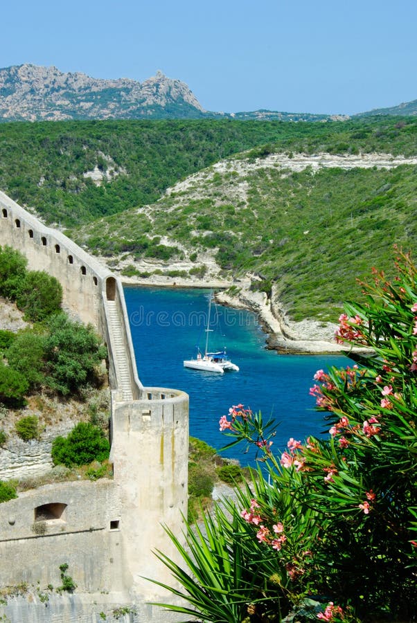 Coastline of town of Bonifacio, island of Corsica, southern France with mountain backdrop. Coastline of town of Bonifacio, island of Corsica, southern France with mountain backdrop.