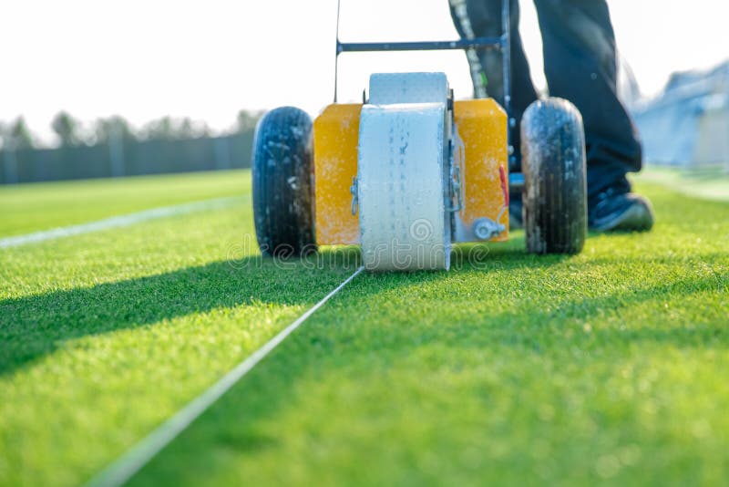 Lining a Football Pitch Using White Paint on Grass Stock Image Image