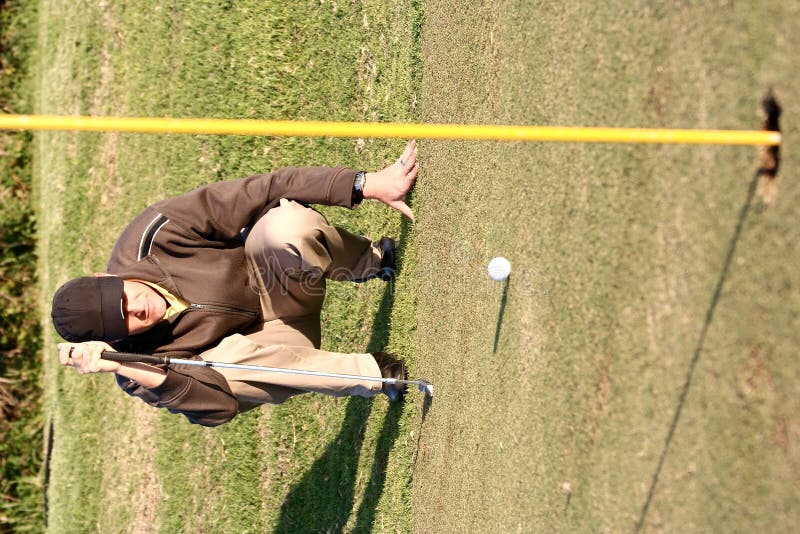 Lining up golf putt