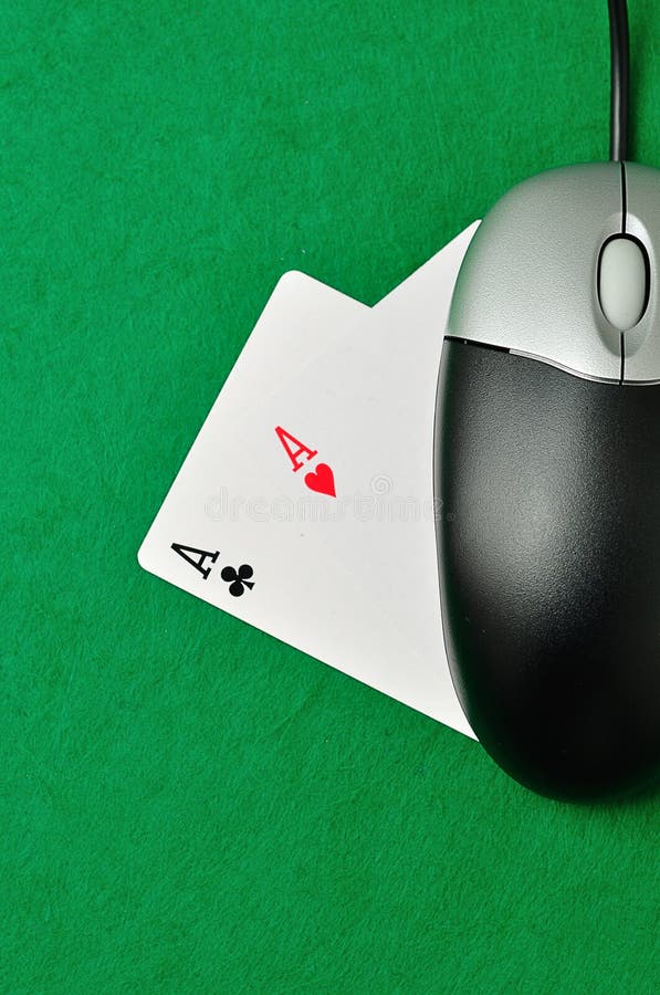 A computer mouse and 2 ace cards symbolizing on line poker. A computer mouse and 2 ace cards symbolizing on line poker