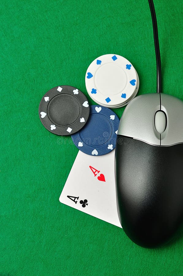 A computer mouse with poker chips and 2 ace cards symbolizing on line poker. A computer mouse with poker chips and 2 ace cards symbolizing on line poker