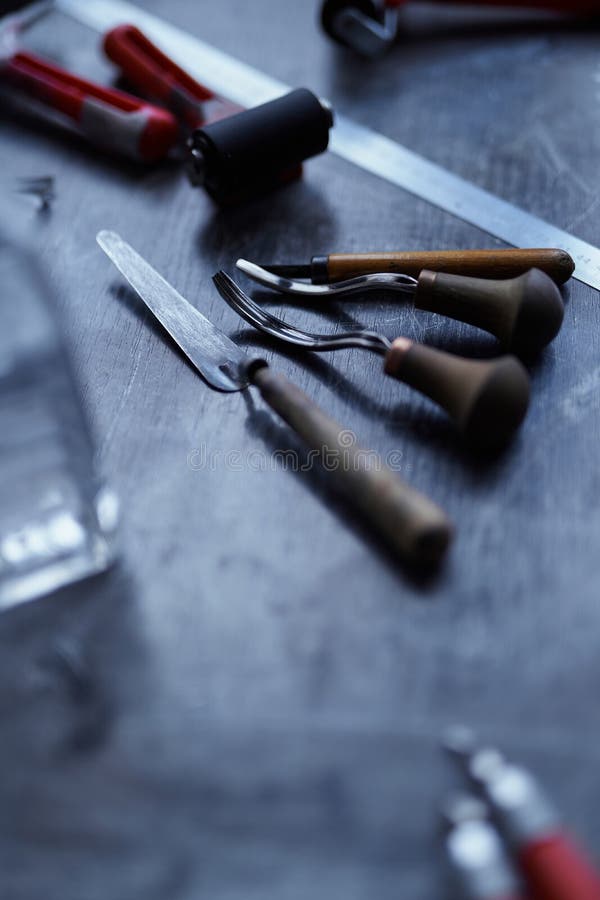 Set of Linocut Tools on a Dark Table with Copy Space Stock Image
