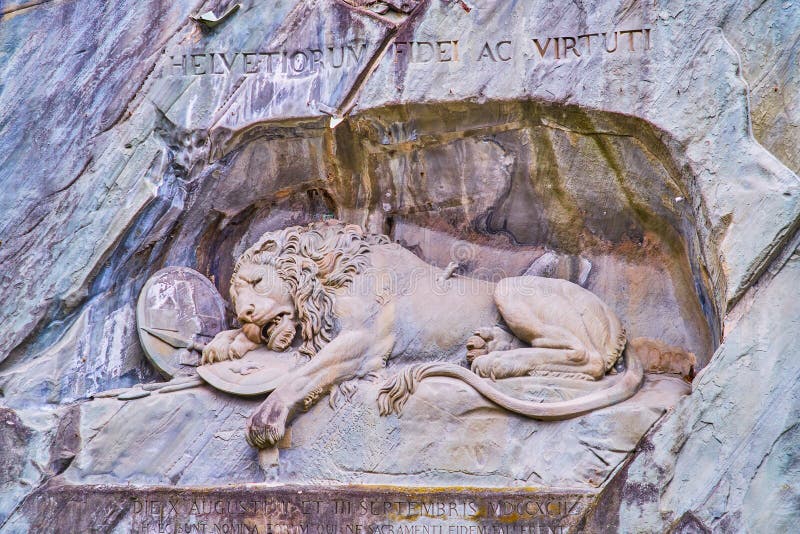 Lion Monument Lowendenkmal carved in a rocky cliff is the most famous monument of Switzerland and a visit card of Lucerne city. Lion Monument Lowendenkmal carved in a rocky cliff is the most famous monument of Switzerland and a visit card of Lucerne city