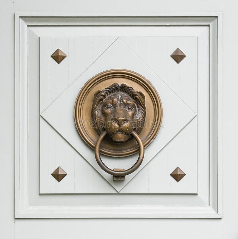 Lionhead knocker found on a door of a classical ma