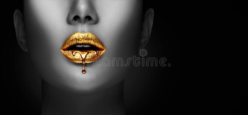 Lipstick dripping. Paint drips, lipgloss dripping from sexy lips, liquid Gold metallic paint drops on beautiful model girl`s mouth