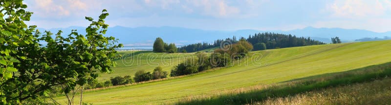 Liptov panorama with Low Tatras Nizke Tatry and Liptovkska Mara water lake reservoir in the background.