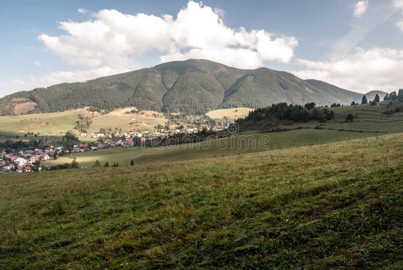 Liptovska Luzna village with hills and meadows around in Slovakia