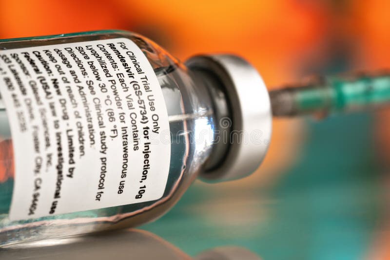Liptovsky Hradok, Slovakia - May 20, 2020: Remdesivir label on vaccine bottle concept, not real product. GS-5734 is antiviral. Drug developed Gilead Sciences stock photo Liptovsky Hradok, Slovakia - May 20, 2020: Remdesivir label on vaccine bottle concept, not real product. GS-5734 is antiviral. Drug developed Gilead Sciences stock photo