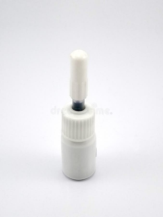 Liquid Black Refill Ink Placed in Small White Plastic Bottle Stock