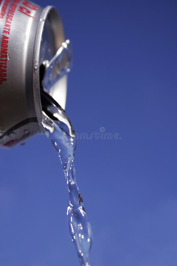 Water flowing from tin can. Water flowing from tin can