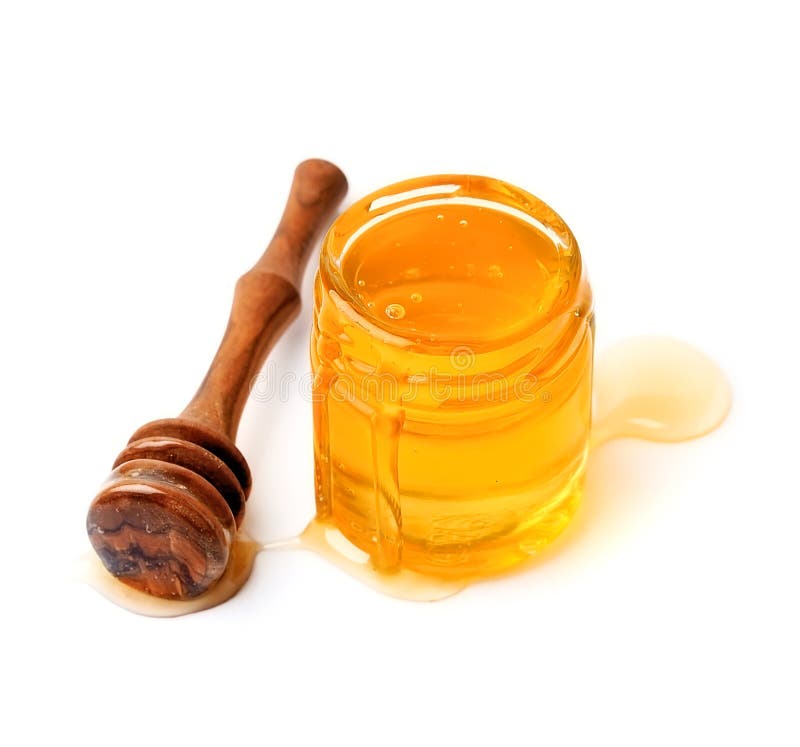 A Jar of Liquid Honey from Linden Flowers and a Stick with Honey on a