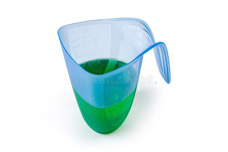 Liquid Laundry Detergent in Measuring Cup on a White Background